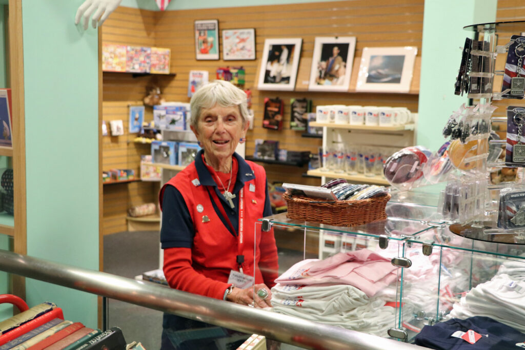 Volunteer Paula poses in the Wright Museum gift shop