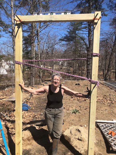 Volunteer Chrisy building new entrance to Victory Garden